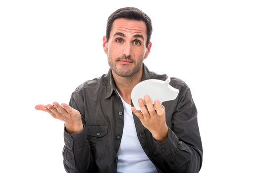 Portrait of a man looking at camera and showing a piggy bank