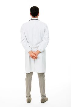 Full length backside view of a male doctor with hands behind his back