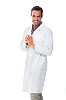 Half length portrait of a smiling male doctor holding stethoscope and looking at camera