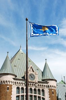 Detail of Gare du Palais the railway and bus station of Quebec City and its flag