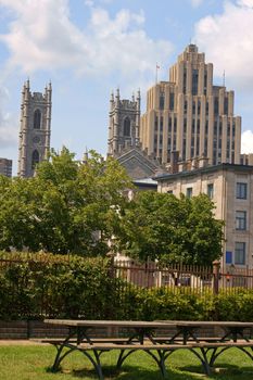Notre Dame Basilica and Aldred building view from Vieux Port in Montreal