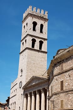 Town Hall tower (Palazzo del Capitano del Popolo) and the temple of Minerva converted in Santa Maria sopra Minerva Church in the historical Assisi.