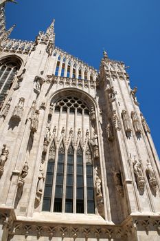 Gothic architecture of Milan Cathedral in Piazza del Duomo. It is the fourth largest church in the world. The construction started in 1386 and took about five centuries.