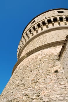 Tower of the fortress of San Leo (also called Montefeltro) built upon a 583 metres high rocky mount. The origins of the fortress are about in the 6th century but the present structure was ordered by Federico da Montefeltro at the end of 15th century. The fortress was also used as a prison where the famous alchemist count Cagliostro died in 1795.