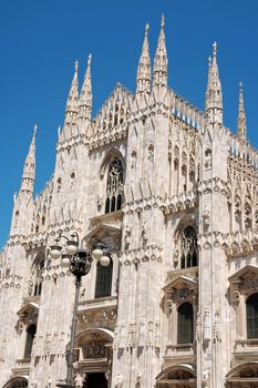 Gothic architecture of Milan Cathedral in Piazza del Duomo. It is the fourth largest church in the world. The construction started in 1386 and took about five centuries.