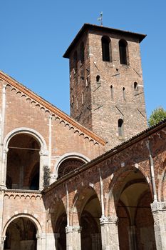 Detail of the bell tower and the cloister of the Church of Saint Ambrose (Sant'Ambrogio) in Milan.