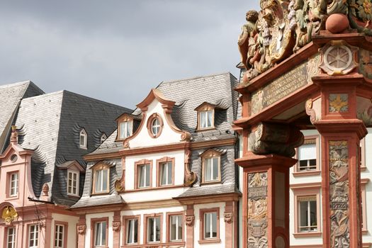 Historical houses in downtown Mainz in Germany on a cloudy day.