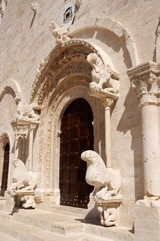 Portal of Ruvo di Puglia Cathedral in the southeast italian region of Apulia. The simple but elegant facade shows a lot of statues with vegetal, animal and human details. The Cathedral was dedicated to Santa Maria Assunta and was built between 12th and 13th century.