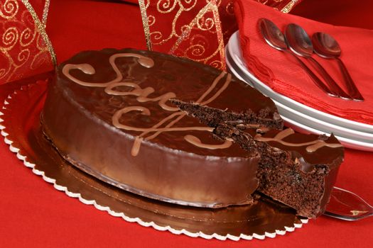 Famous austrian chocolate cake called sacher torte served on a golden plate. Selective focus.