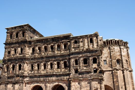 The Porta Nigra is a 2nd-century Roman city gate in Trier, Germany. It was given its name (which means "black gate") in the Middle Ages because of its weathered color. The Porta Nigra is the only one of four Roman gates that still stands in Trier, the eldest city in Germany.