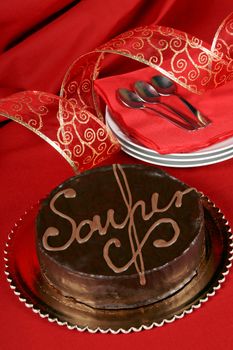 Famous austrian chocolate cake called sacher torte served on a golden plate. Selective focus.