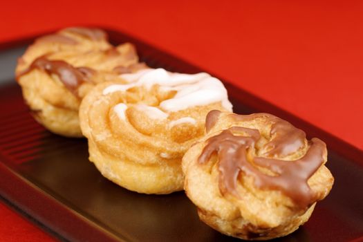 Zeppole di San Giuseppe or St. Joseph's Day Cream Puffs, are south italian deep fried cakes, filled with custard and frosted.