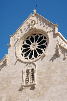 Ruvo di Puglia Cathedral in the southeast italian region of Apulia. The simple but elegant facade shows a lot of statues with vegetal, animal and human details. The Cathedral was dedicated to Santa Maria Assunta and was built between 12th and 13th century.