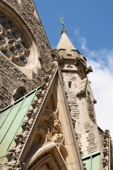 This was formerly the first Anglican Cathedral of Montreal. The original Christ Church Cathedral was destroyed by fire in 1856. The present cathedral, a Neo-gothic structure, was designed by architect Frank Wills. It was completed in 1859 and consecrated in 1867. Unfortunately, the design, though acclaimed for its architecture, suffered from important engineering flaws. The soft ground could not support the heavy central stone tower and steeple, which began to subside and lean. The steeple had to be removed in 1927. New foundations were poured in 1939, and in 1940, an anonymous donation permitted the construction of a much lighter steeple made of aluminum, moulded to simulate the former stone spire. It is 28 metres high, attaining a height of 70 metres off the ground. Recent additions to the church include a choir gallery, built in 1980, and the church's third organ, completed in 1981. Under the church there's one of the biggest malls of Montreal.