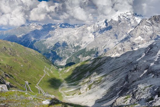 The Stelvio Pass in a dramatic panorama of a summer afternoon