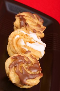 Zeppole di San Giuseppe or St. Joseph's Day Cream Puffs, are south italian deep fried cakes, filled with custard and frosted.