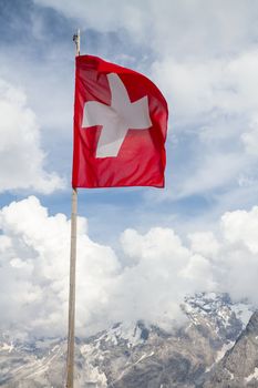 Swiss flag on a summer day on the Stelvio pass