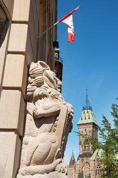 Detail of the historic building of the canadian Central post Office and the Parliament building in downtown Ottawa.
