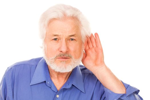 Handsome elderly man holds hand on ear isolated over white background