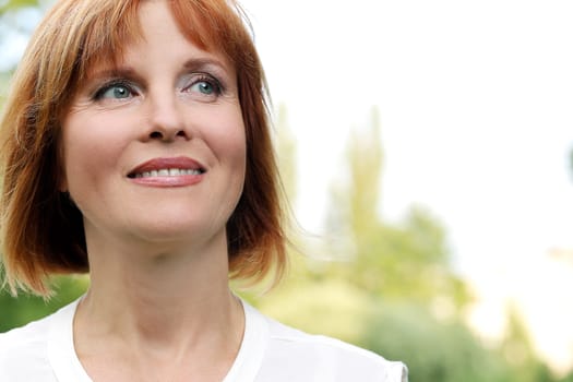 Portrait of an attractive woman who is relaxing at a park