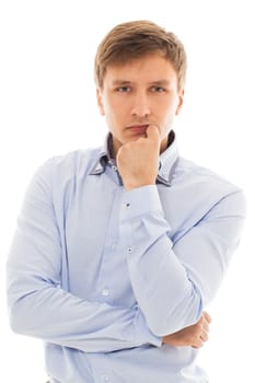 Handsome man in a blue shirt is thinking over a white background
