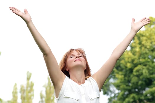 Portrait of an attractive woman who is posing at a park