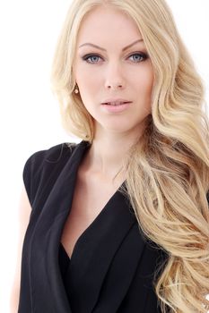 Portrait of a beautiful girl with blonde and curly hair who is posing over a white background