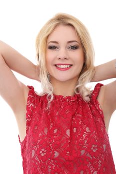 Portrait of a beautiful blonde girl with curly hair who is wearing red blouse and posing over a white background