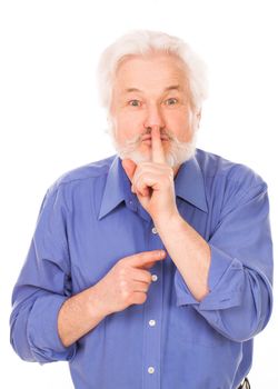 Handsome elderly man with gray beard asks be quiet isolated over white background