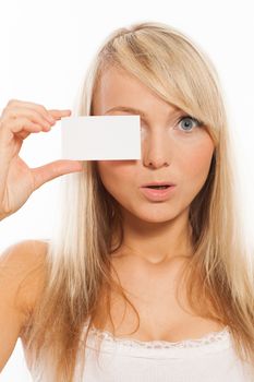 Young attractive woman with empty card isolated over white background