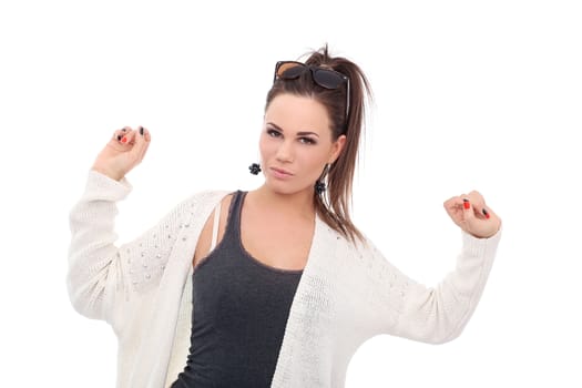 Portrait of a beautiful girl with brown hair who is posing in long white blouse over a white background