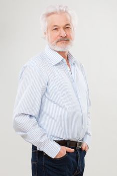 Handsome elderly man with beard isolated over white background