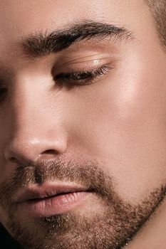 Closeup photo of a handsome man with a beard