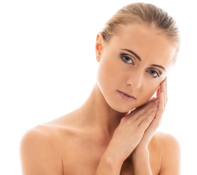 Portrait of a beautiful girl with naked shoulders who is posing over a white background