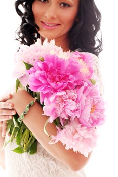 Beautiful caucasian woman with bouquet of peonies