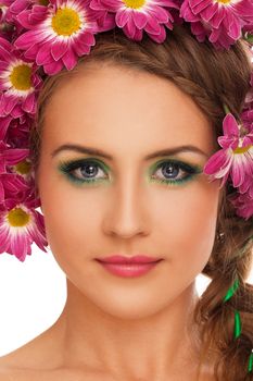 Beautiful young caucasian woman with flowers in hairover white background