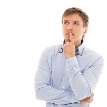 Handsome man in a blue shirt is thinking over a white background