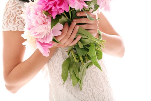 Beautiful bouquet of rose peonies in woman's hands