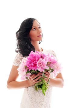 Portrait of beautiful young woman with peonies bouquet on a white background