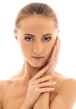 Portrait of a beautiful girl with naked shoulders who is posing over a white background