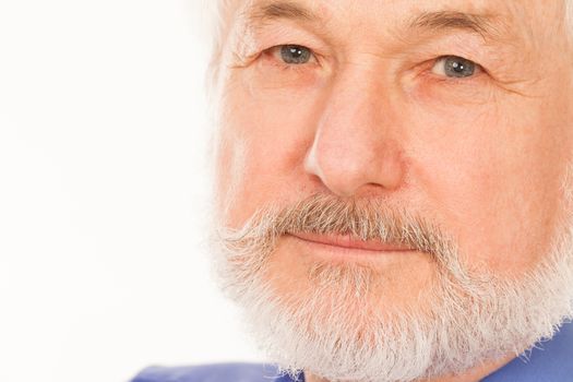 Handsome elderly man with gray beard over white background