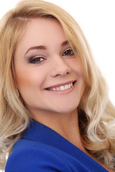 Portrait of a beautiful blonde girl with curly hair who is posing in blue jacket over a white background