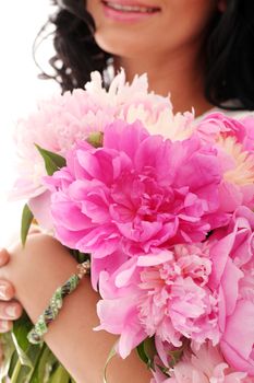 Beautiful bouquet of rose peonies in woman's hands