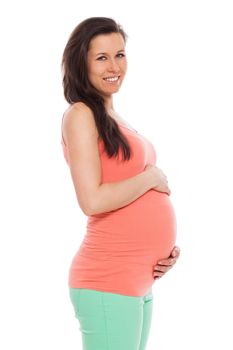 Beautiful pregnant woman isolated over white background