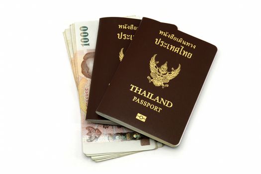 Thailand passport and Thai money isolated on white background