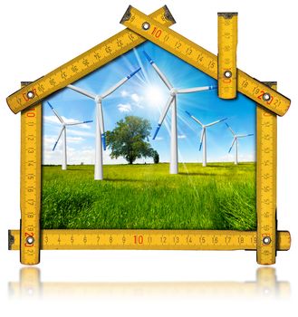 Wooden yellow meter tool forming a ecologic house with wind energy turbine power station inside. Isolated on white background