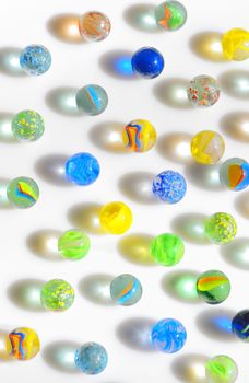 Colorful different Marbles on white background