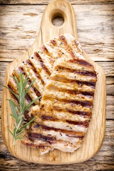 Grilled pork chops pieces. Spices and rosemary.