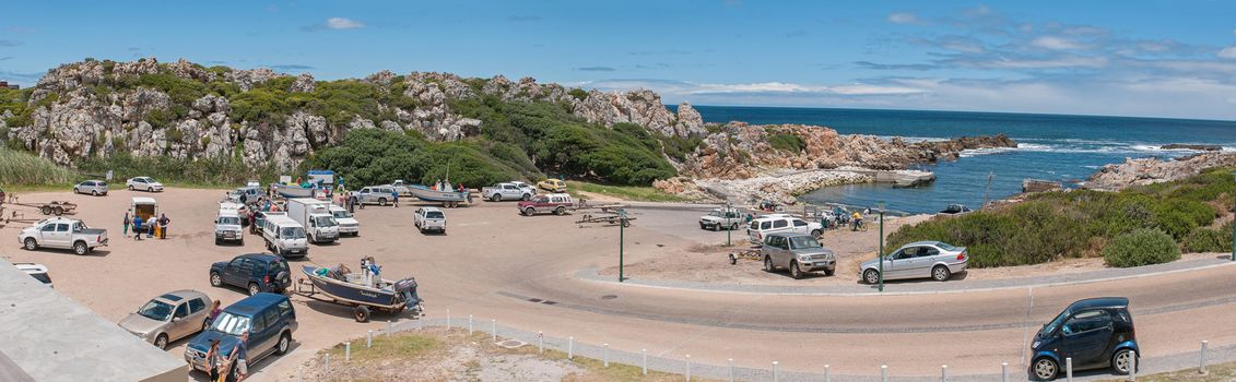 KLEINMOND, SOUTH AFRICA - DECEMBER 23, 2014: Panorama of crayfish boats with unidentified fishermen at the harbor in Kleinmond near Cape Town