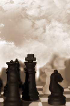 chess pieces isolated against a cloudy sky background